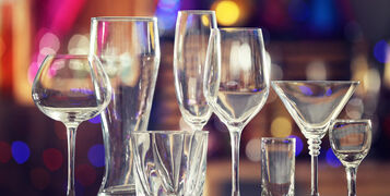 Different,Glassware,On,Blurred,Background
