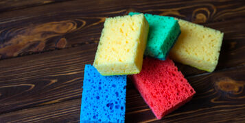 Red,,Blue,,Green,,Yellow,Sponge,For,Washing,On,A,Wooden